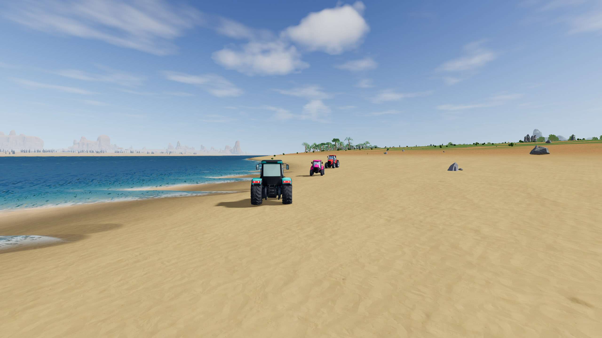 Teal, pink and red tractors driving along a wide sandy beach beside turquoise water, with palms on the shore ahead.