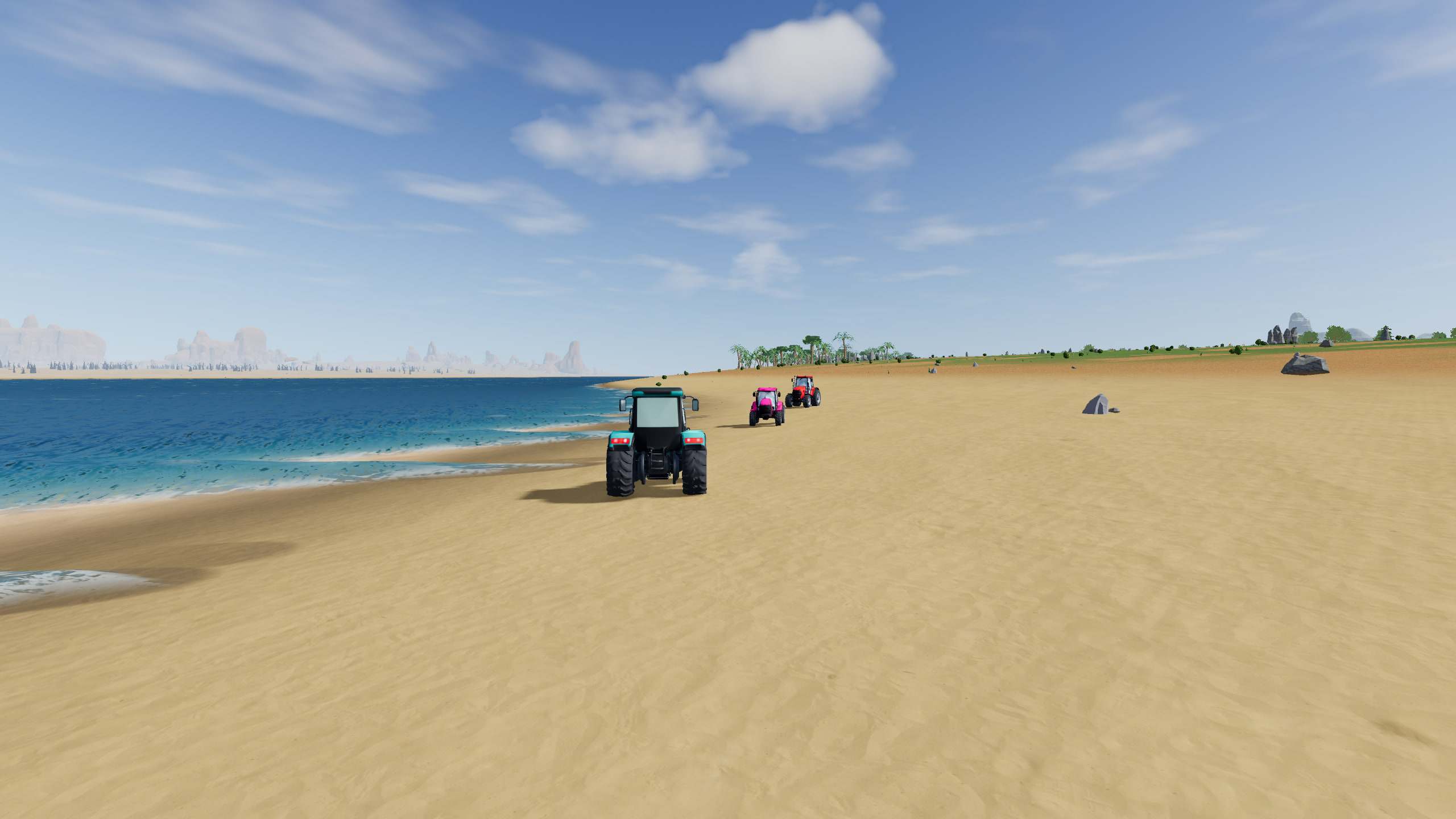 Teal, pink and red tractors driving along a wide sandy beach beside turquoise water, with palms on the shore ahead.